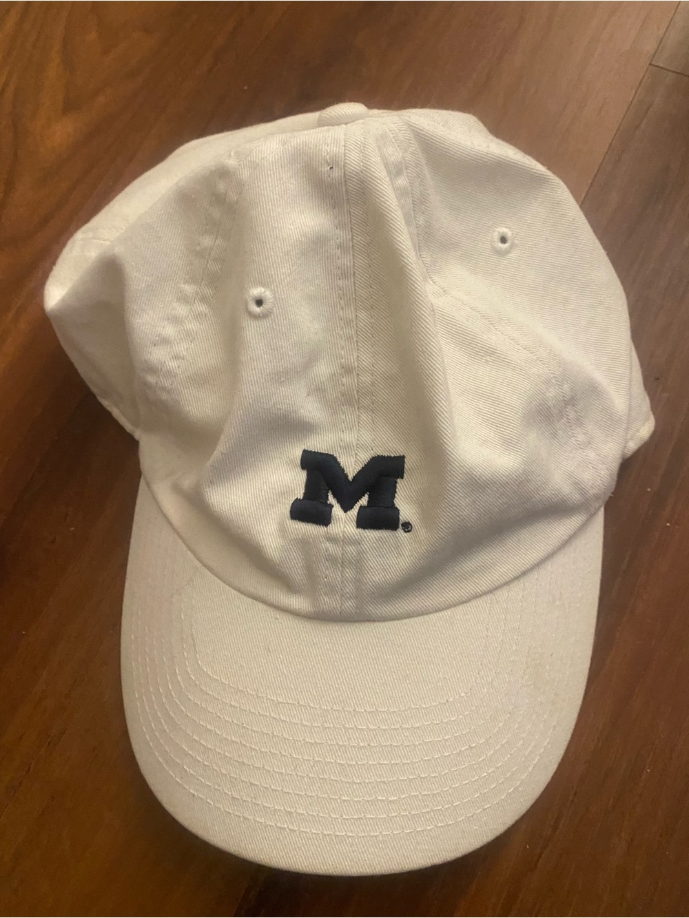 White Baseball Cap with Navy 'M' Logo